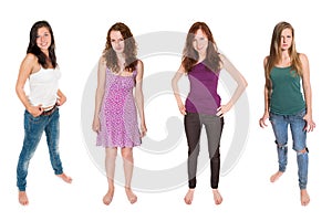 Full length portraits of four beautiful girls wearing casual summer clothes