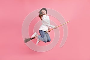 Full length profile photo of brown hairdo millennial lady jump wear hoodie jeans sneakers isolated on pink background