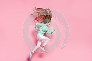 Full length profile photo of charming running person hurry wear teal sweater isolated on pink color background