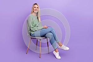 Full length profile side photo of young cheerful woman sit chair comfort talk-show isolated over violet color background