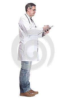 full-length. qualified doctor with clipboard. isolated on a white