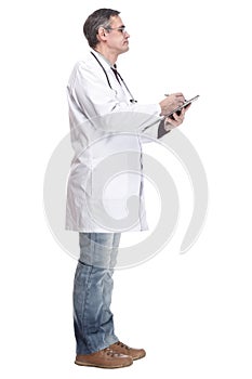 full-length. qualified doctor with clipboard. isolated on a white