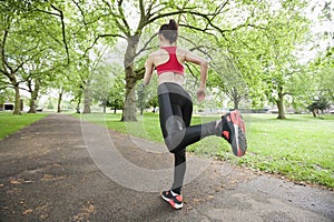 Full length rear view of woman jogging in park