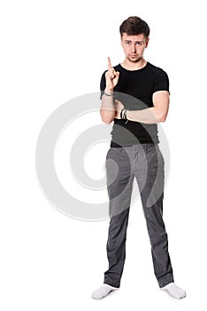 Full length of serious young man with light beard indicting with