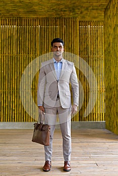 Full length shot of African businessman outdoors