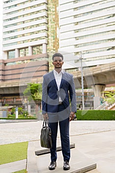 Full length shot of African businessman outdoors in city