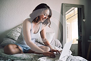 Ive found some perfect ideas for my blog. Full length shot of an attractive young woman smiling while using a laptop in