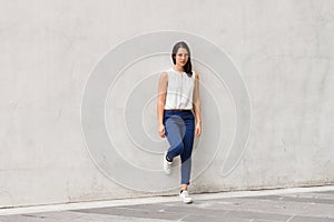 Full length shot of beautiful young woman standing outdoors