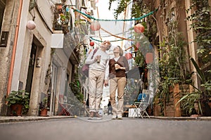 Full Length Shot Of Happy Senior Tourists Couple Walking Outdoors