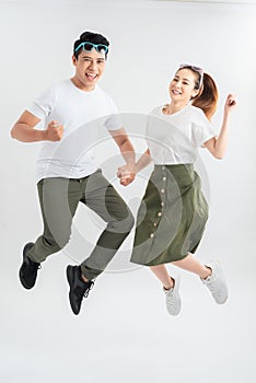 Full length shot of jumping couple having fun together