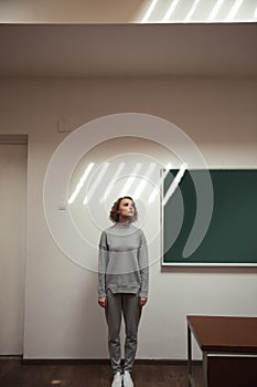 Full-length shot of woman standing near board