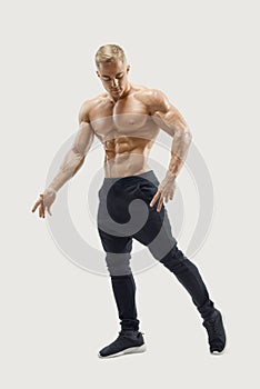 Full-length shot of young man with muscular body