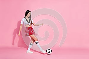 Full length side photo of cool lady soccer ball floor player score goal wear red short skirt white top isolated pink