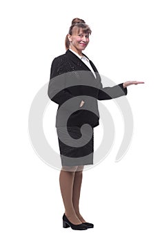 Full length, side view of a confident young business woman standing with folded hands