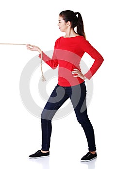 Full length strong woman puling rope