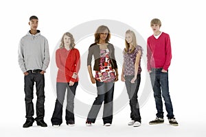 Full Length Studio Portrait Of Five Teenage Friend