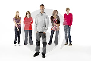 Full Length Studio Portrait Of Five Teenage Friend