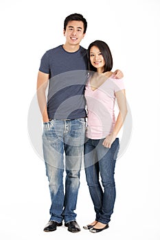 Full Length Studio Shot Of Chinese Couple