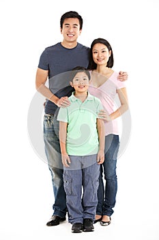 Full Length Studio Shot Of Chinese Family