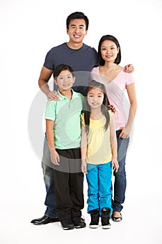 Full Length Studio Shot Of Chinese Family