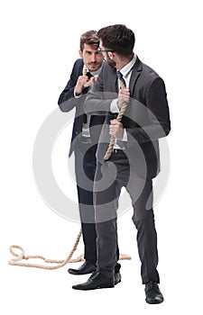 full length . two businessmen pulling a long rope.