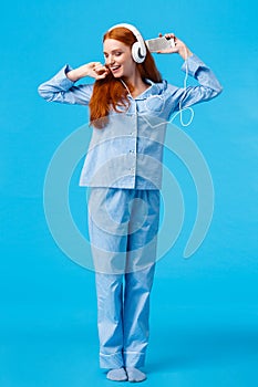 Full-length vertical shot cheerful and upbeat, carefree redhead teenage girl dancing and enjoying beautiful morning