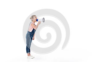 Full length view of adorable little girl screaming in megaphone