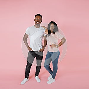 Full length view african american woman in casual outfit leaning on man standing with hands