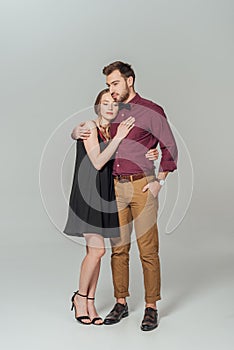 Full length view of beautiful stylish young couple on love embracing