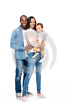 full length view of happy african american family with one kid smiling at camera