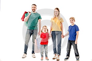 Full length view of smiling family with shopping bags