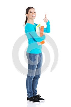 Full length woman holding notes showing thumbs up