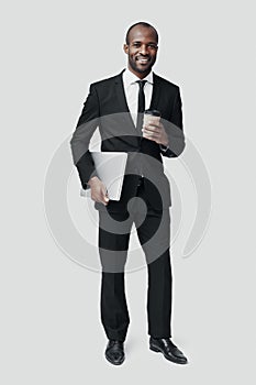 Full length of young African man in formalwear photo