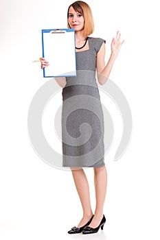 Full length young business woman standing with her clipboard iso