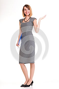 Full length young business woman standing with her clipboard iso