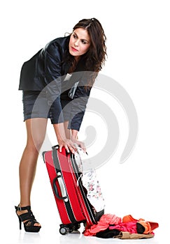 Full length young business woman to late red travel bag