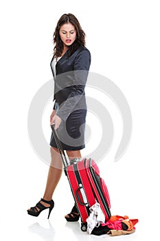 Full length young business woman to late red travel bagd