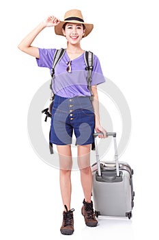Full length of young woman in casual walking with the travel bag