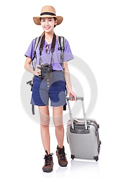 Full length of young woman in casual walking with the travel bag