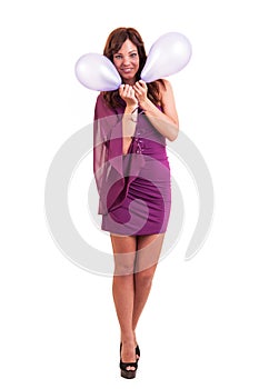 Full length young woman with pink balloons as a present for birthday party