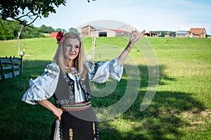 Full length of young woman with red flower in her hair