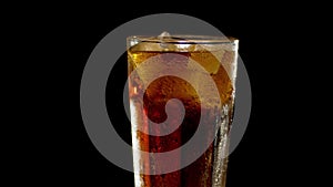 Full misted glass of cola rotated
