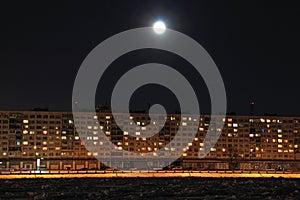 Full moon above the apartment building