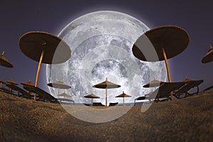 Full Moon and Beach Umbrellas