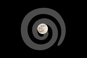 Full moon on a black cloudless sky. A natural satellite