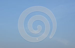 Full moon on bright sky in evening