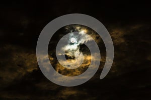 Full moon and clouds on stormy overcast night