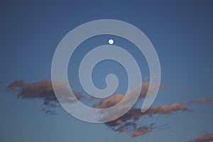 full moon and clouds at sunset