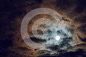 Full moon and cloudy sky, mysterious night atmosphere, fantasy and mysterious moonlight concept, copy space