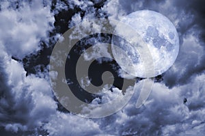 Full moon and cloudy sky at night Elements of this image furnished by NASA